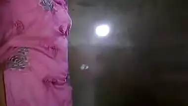 Slinky sex Indian woman takes her clothes off and flashes her XXX tits