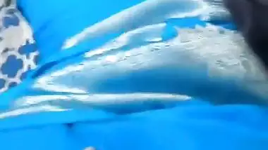 Desi chudai of Bhabhi lying on bed in blue saree