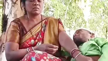 Outdoor sex of a handicapped man with a milf in the jungle