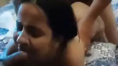 A girl gets cum on her face in an Indian threesome blue film
