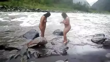 Two fat Desi women show their XXX assets while relaxing naked in river