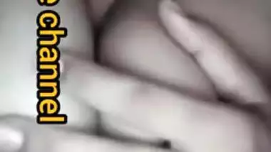 Naughty Desi woman squeezes tits to lick nipples in the porn video