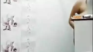 Pregnant aunty of Indian origin puts on clothes after taking a shower