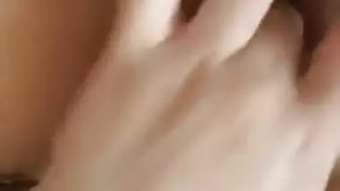 Naked Indian holds camera with one hand and fingers XXX hole with another