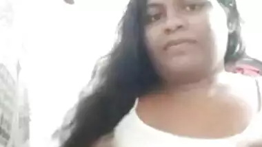 Long-haired Desi hussy takes top off to reveal her big XXX breasts